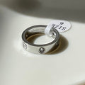 Stone paved silver love ring