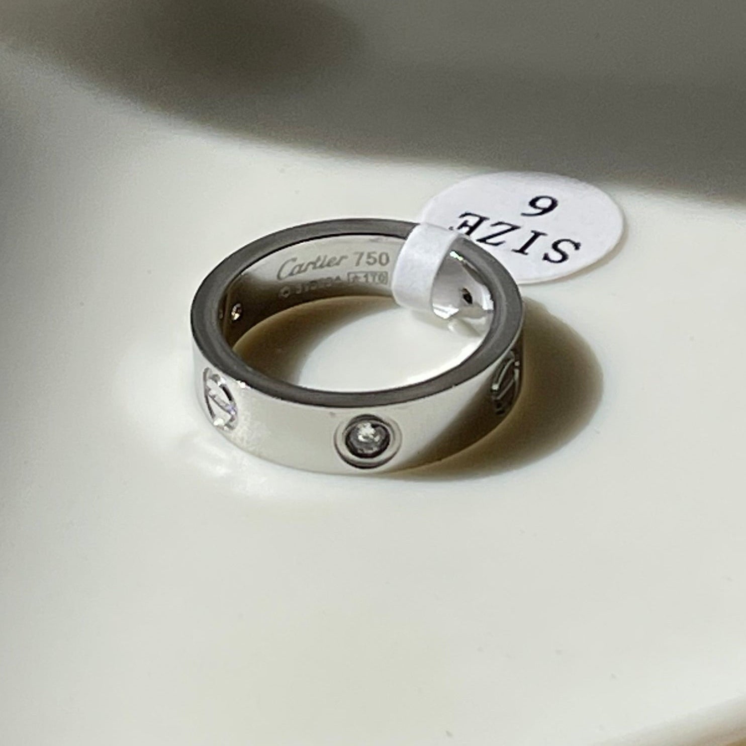 Stone paved silver love ring