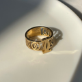 Gold toned pierced ring