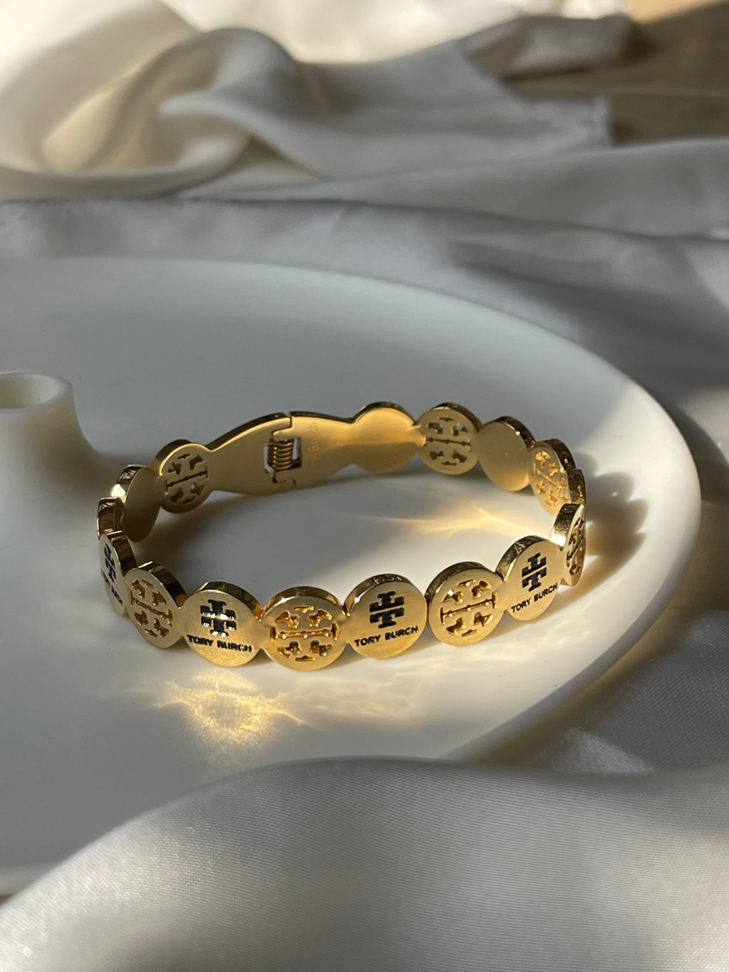 Gold toned twirl bangle