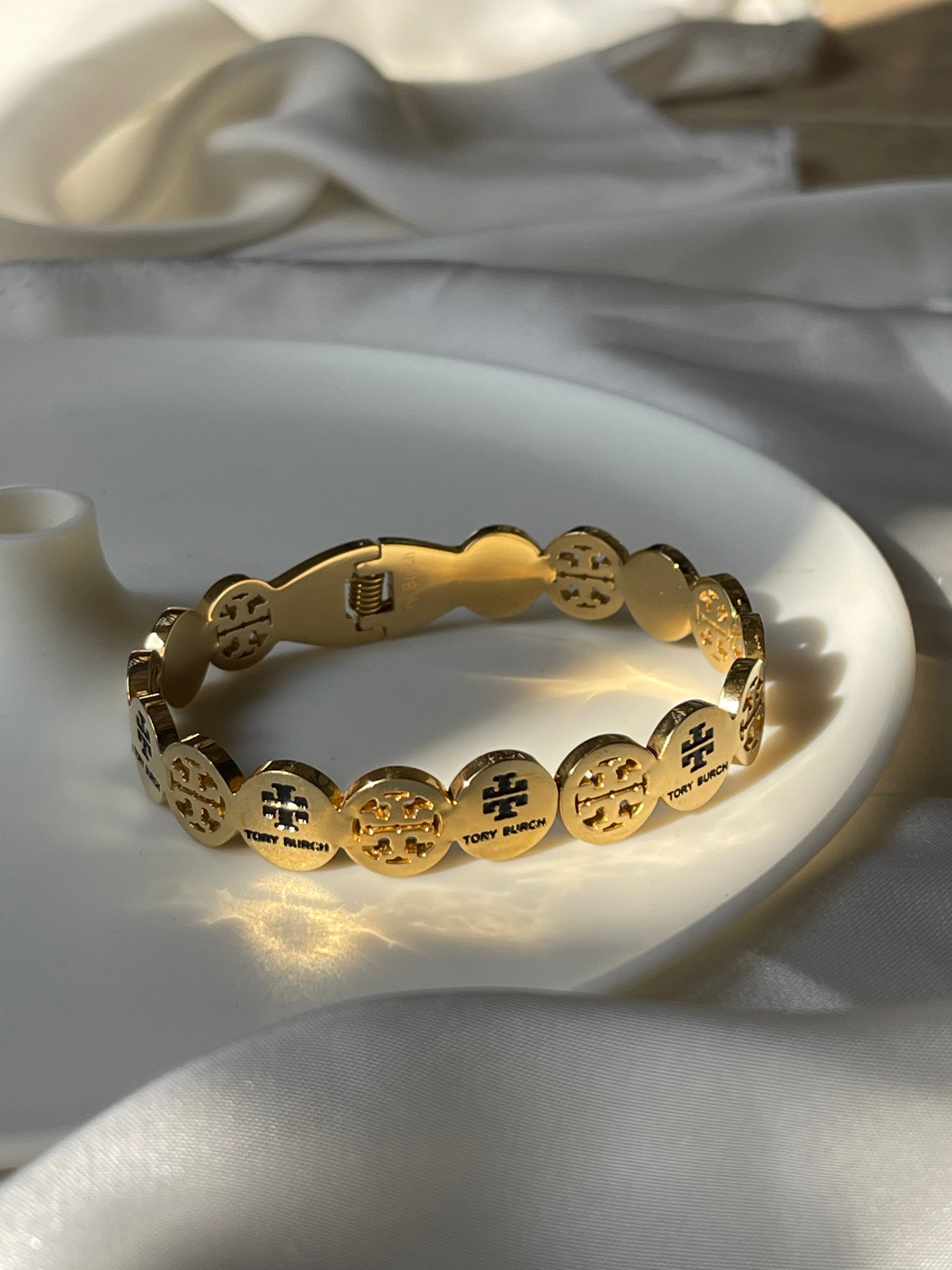 Gold toned twirl bangle